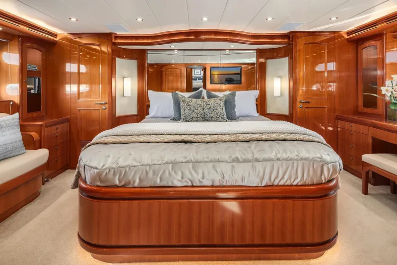 Slide: The Image of Luxurious bedroom interior of 2014 Hampton 720 Skylounge LRC yacht with elegant wood finishes. - 46