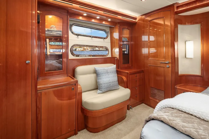 Slide: The Image of Luxurious bedroom interior of 2014 Hampton 720 Skylounge LRC yacht with wood finish. - 51