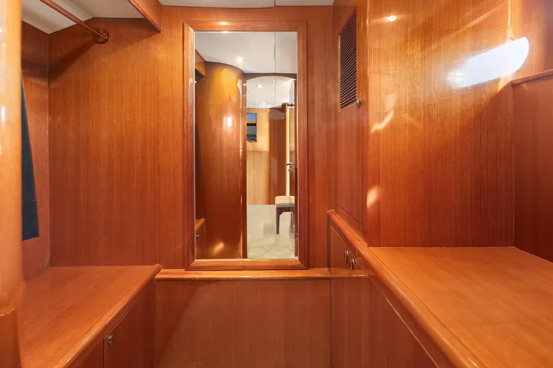 Slide: The Image of Luxurious twin cabin in 2014 Hampton 720 Skylounge LRC yacht, featuring elegant wood finishes. - 52