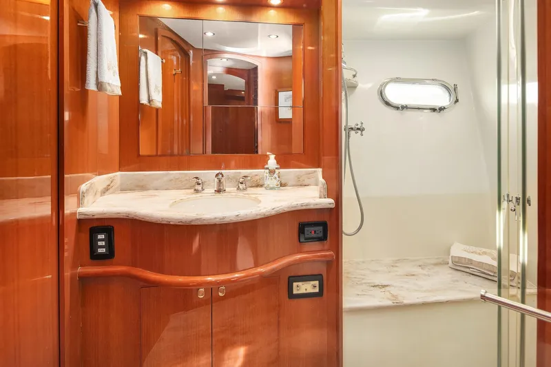 Slide: The Image of Luxurious 2014 Hampton 720 Skylounge LRC yacht interior with modern kitchen and wooden cabinetry. - 56