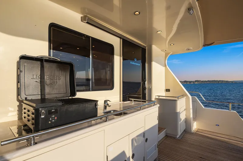 Slide: The Image of Luxurious 2014 Hampton 720 Skylounge LRC yacht interior with elegant dining area and scenic views. - 62
