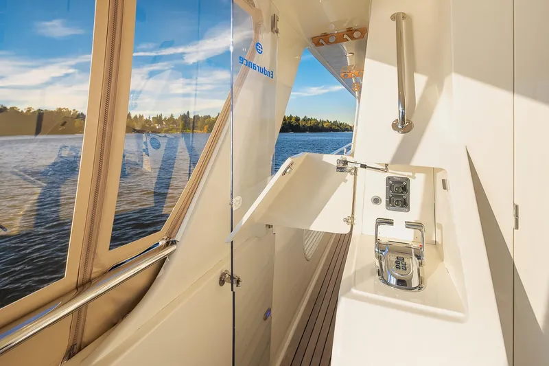 Slide: The Image of Luxurious 2014 Hampton 720 Skylounge LRC yacht interior with elegant dining area and scenic ocean view. - 69