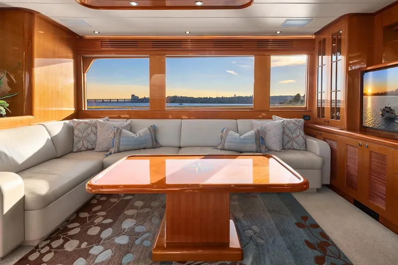Slide: The Image of Luxurious interior of 2014 Hampton 720 Skylounge LRC yacht with elegant seating and wooden accents. - 7