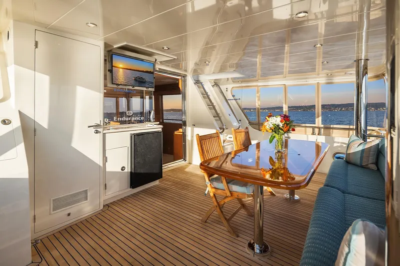 Slide: The Image of 2014 Hampton 720 Skylounge LRC yacht at sunset on serene water. - 76