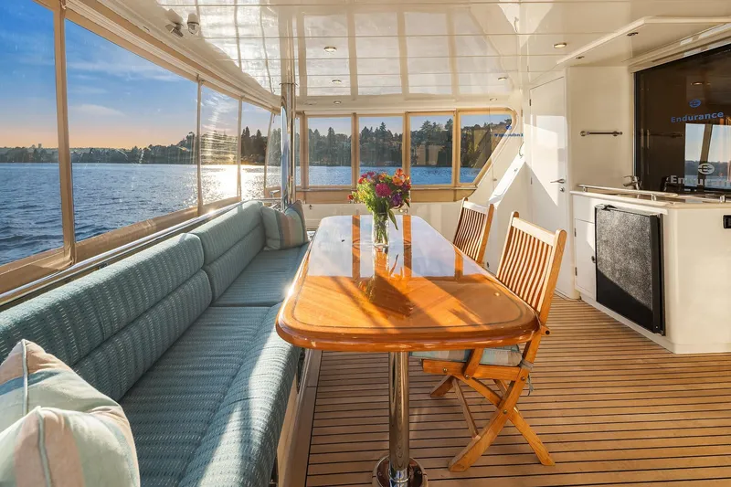 Slide: The Image of Side deck view of 2014 Hampton 720 Skylounge LRC yacht cruising on open water. - 78