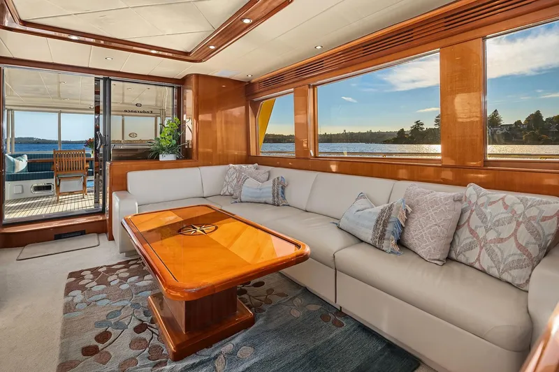 Slide: The Image of Luxurious interior of 2014 Hampton 720 Skylounge LRC yacht with elegant seating and wooden accents. - 8