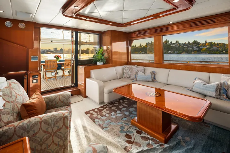 Slide: The Image of Interior of 2014 Hampton 720 Skylounge LRC yacht with wooden finish and ocean view. - 9