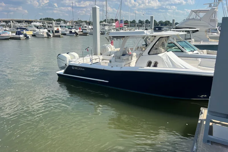 Slide: The Image of 2017 Belzona 325 Center Console with twin Mercury 300 engines, docked in Boca Raton. - 10