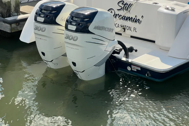 Slide: The Image of 2017 Belzona 325 Center Console boat cruising on a calm, scenic waterway. - 14