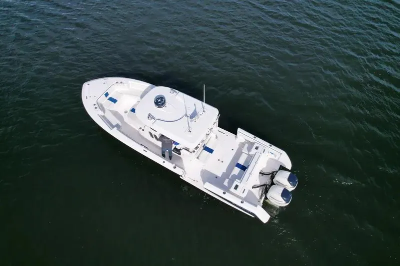Slide: The Image of Aerial view of 2017 Belzona 325 Center Console boat on open water. - 20