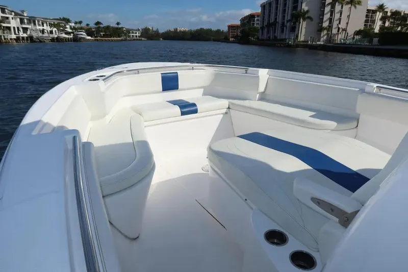 Slide: The Image of 2017 Belzona 325 Center Console boat with spacious seating on calm water. - 23