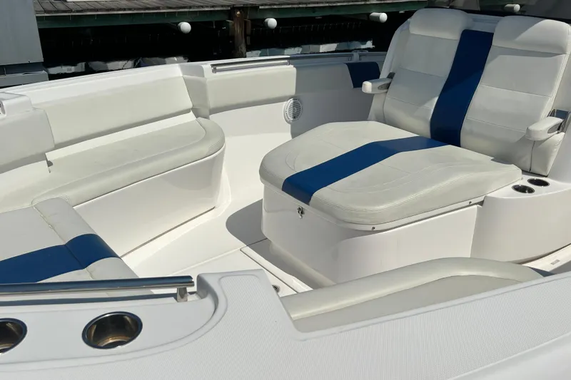 Slide: The Image of 2017 Belzona 325 Center Console boat interior with white and blue seating. - 29