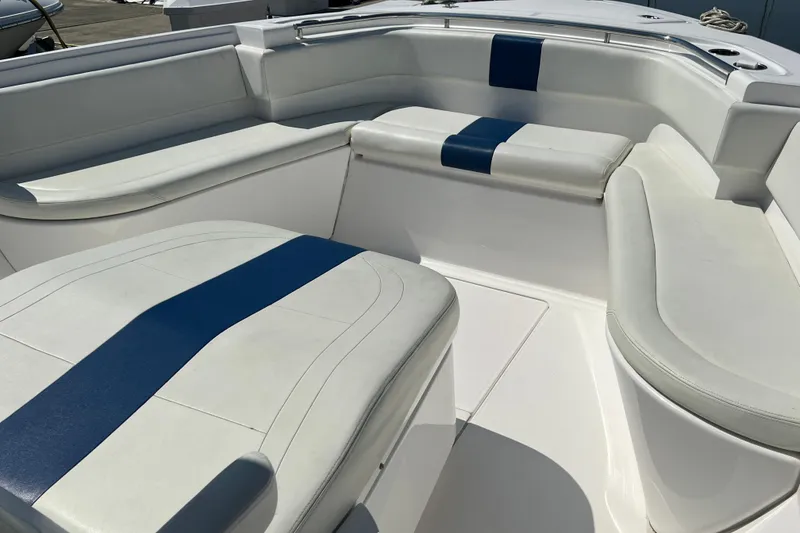 Slide: The Image of 2017 Belzona 325 Center Console boat interior with white and blue seating. - 36
