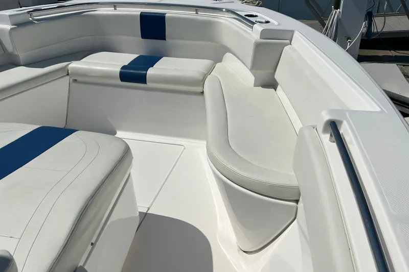 Slide: The Image of 2017 Belzona 325 Center Console boat interior with white and blue seating. - 37