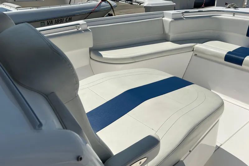 Slide: The Image of 2017 Belzona 325 Center Console boat interior with white and blue seating. - 38