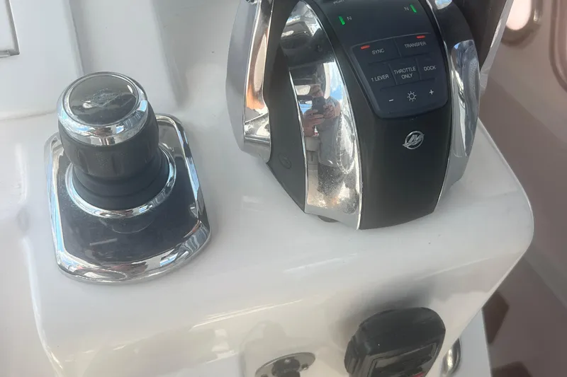 Slide: The Image of 2017 Belzona 325 Center Console boat with spacious white seating area. - 4