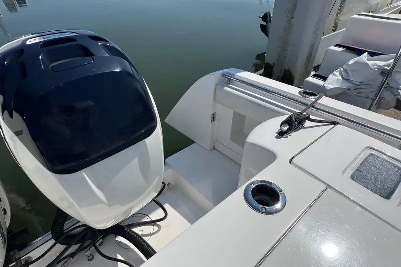 Slide: The Image of 2017 Belzona 325 Center Console boat with outboard motor, docked at marina. - 61