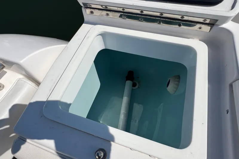 Slide: The Image of Livewell on 2017 Belzona 325 Center Console boat, open lid, partially filled with water. - 62
