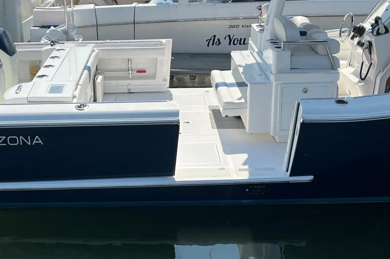 Slide: The Image of 2017 Belzona 325 Center Console boat with sleek design and spacious deck. - 67