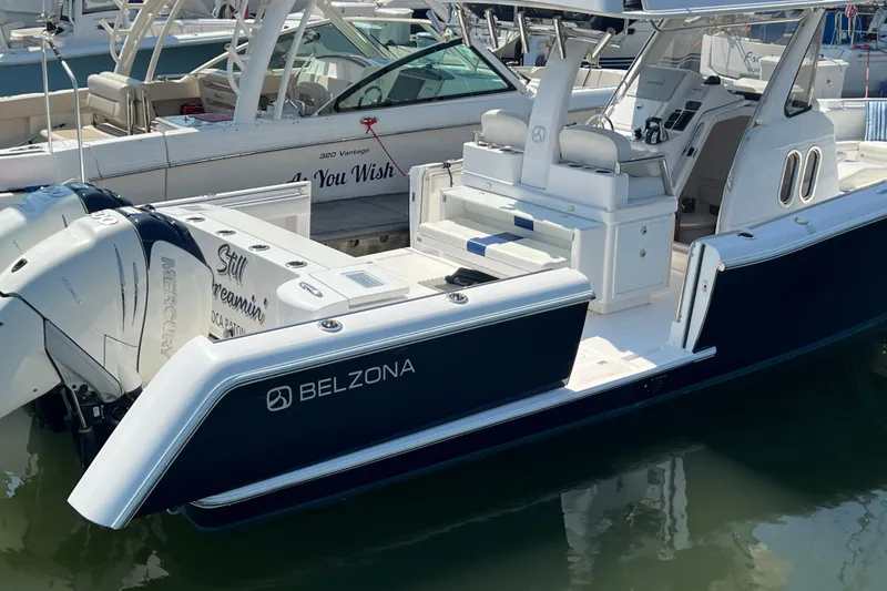 Slide: The Image of 2017 Belzona 325 Center Console boat docked with twin Mercury engines. - 68