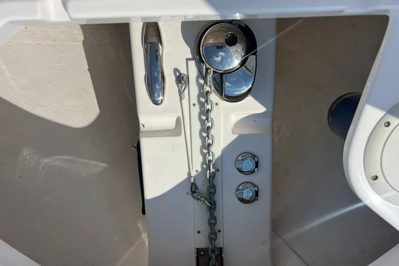 Slide: The Image of Twin Mercury outboard engines on a 2017 Belzona 325 Center Console boat. - 7