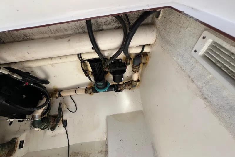 Slide: The Image of 2017 Belzona 325 Center Console boat interior plumbing and wiring system. - 74