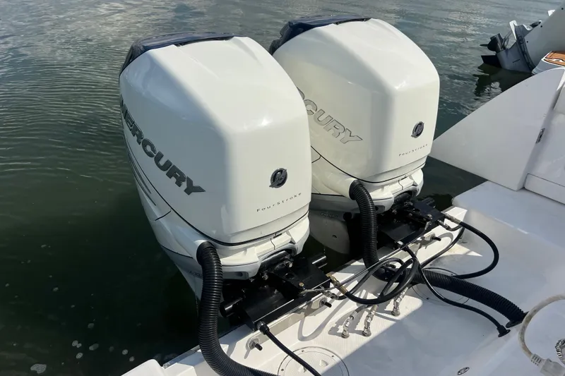 Slide: The Image of 2017 Belzona 325 Center Console boat docked at marina with Mercury engines. - 9