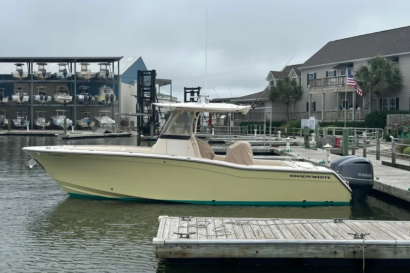 The Image of 2020 Grady-White Canyon 271 boat docked at marina with Yamaha outboard engine. - 0