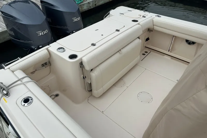 Slide: The Image of 2020 Grady-White Canyon 271 boat interior with Yamaha 300 engines, docked. - 14
