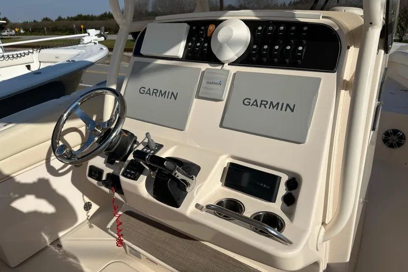 Slide: The Image of 2020 Grady-White Canyon 271 boat dashboard with Garmin navigation system. - 21