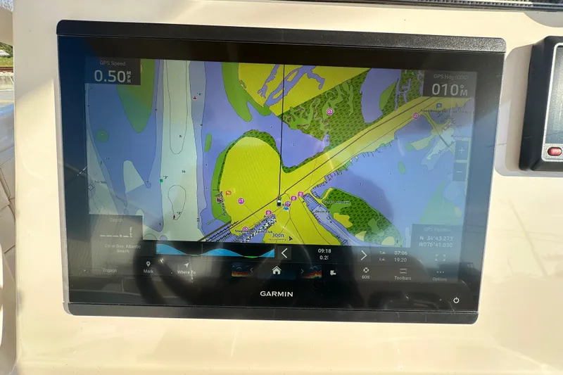 Slide: The Image of Garmin navigation display on 2020 Grady-White Canyon 271 boat, showing detailed marine map. - 27