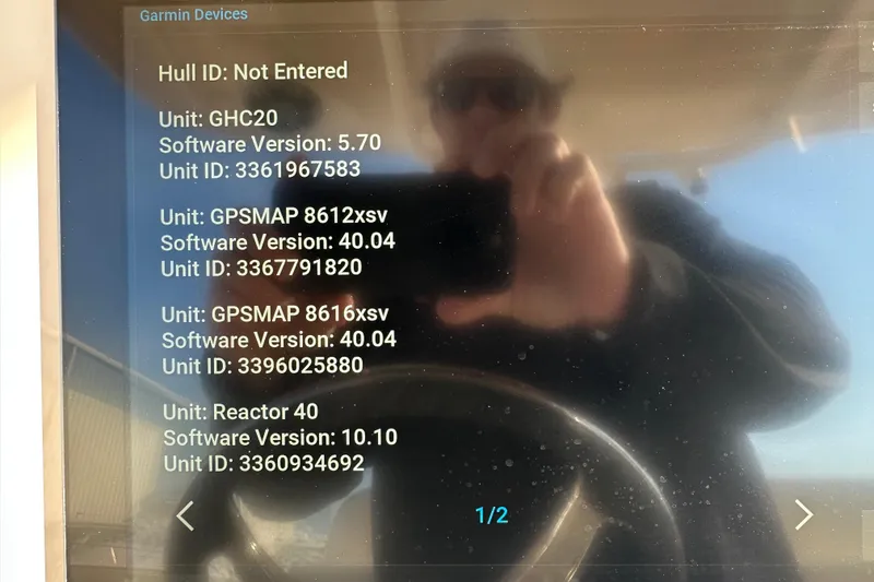 Slide: The Image of Garmin device screen on 2020 Grady-White Canyon 271 boat displaying software versions. - 28