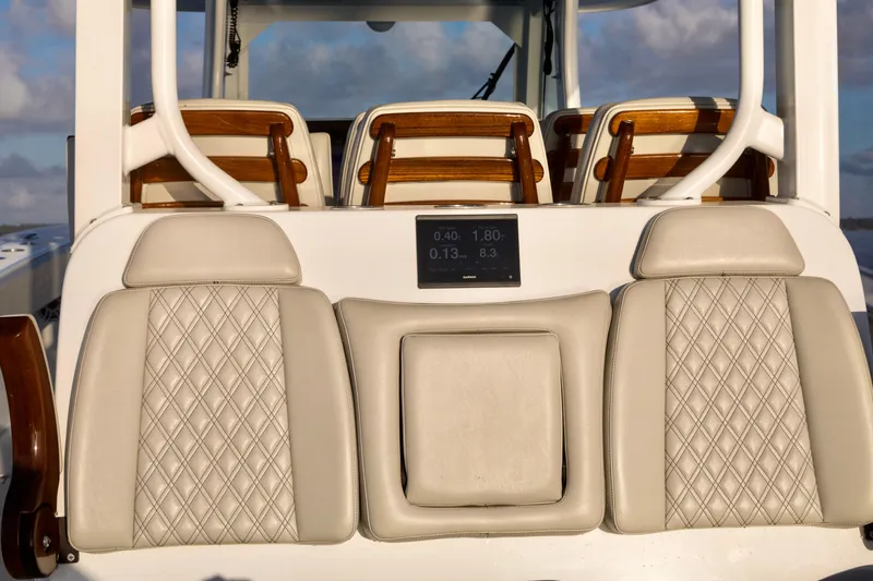 Slide: The Image of Luxury seating on a 2021 Freeman 47 boat, featuring elegant diamond-stitched upholstery. - 13