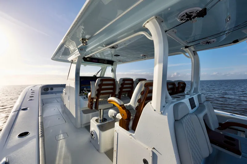 Slide: The Image of Luxury Freeman 47 boat interior, 2021 model, with sleek seating and ocean view. - 14