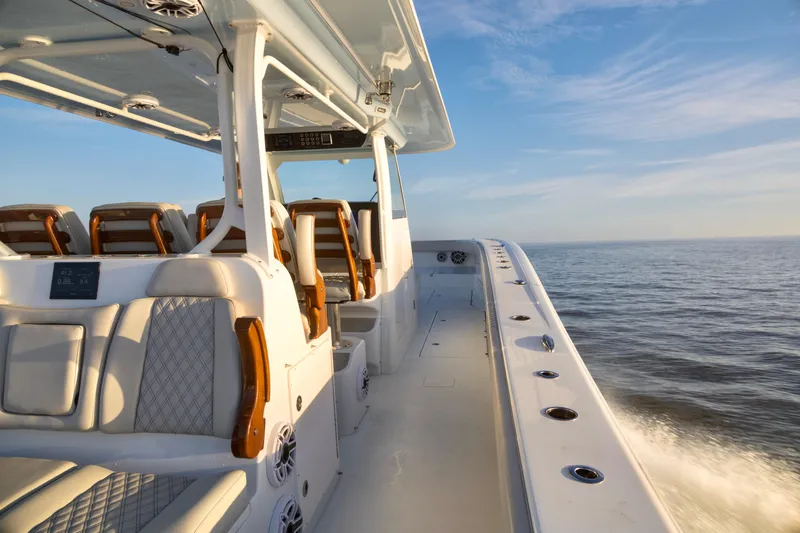 Slide: The Image of Luxurious 2021 Freeman 47 boat interior cruising on open water under clear skies. - 15