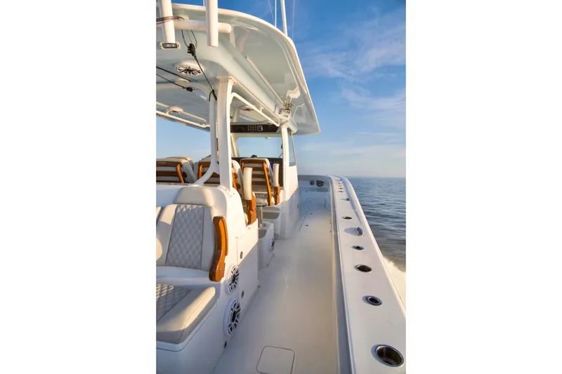 Slide: The Image of 2021 Freeman 47 boat interior with luxurious seating and ocean view. - 16