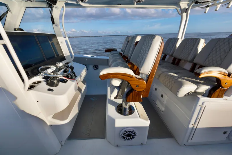 Slide: The Image of Interior of 2021 Freeman 47 boat with luxurious seating and advanced navigation controls. - 19