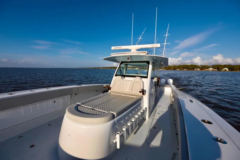 Slide: The Image of 2021 Freeman 47 boat on open water under clear blue sky. - 23