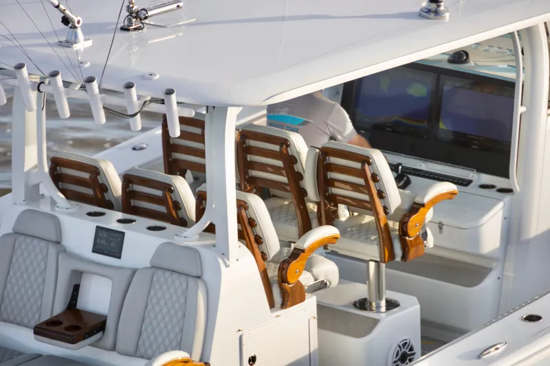 Slide: The Image of Luxury seating and controls on a 2021 Freeman 47 boat, featuring modern design and technology. - 5