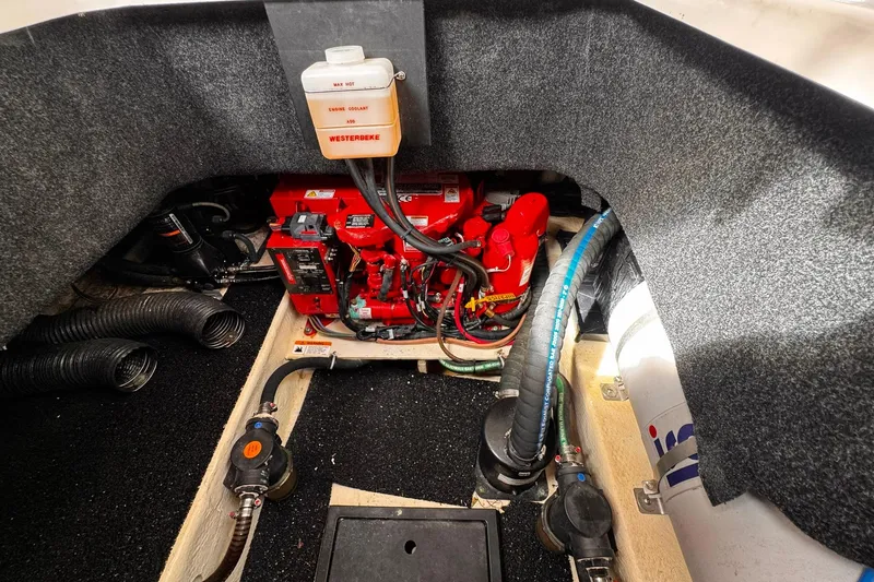 Slide: The Image of Engine compartment of 2021 Regal 26 XO boat with Westerbeke generator. - 25