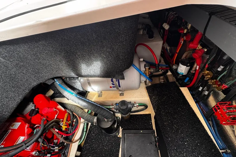 Slide: The Image of Engine compartment of a 2021 Regal 26 XO boat, showcasing wiring and components. - 26