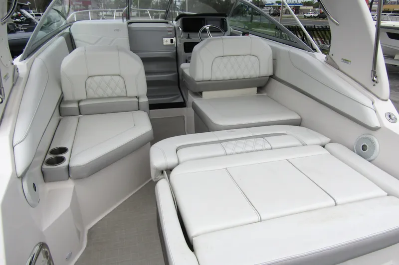 Slide: The Image of 2021 Regal 26 XO boat interior with luxurious white seating and modern design. - 37
