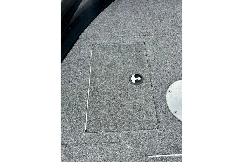 Slide: The Image of 2018 Crestliner CVN16 boat deck with storage compartment and latch. - 14