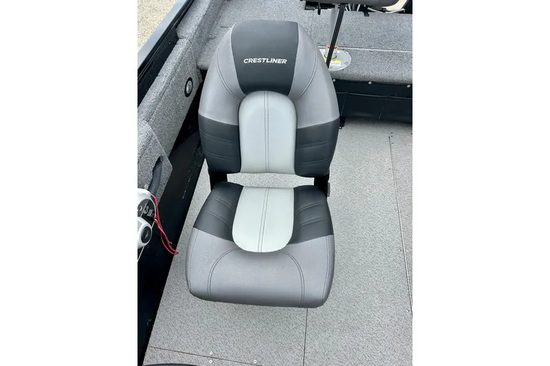 Slide: The Image of 2018 Crestliner CVN16 boat seat, gray and black upholstery, on a carpeted deck. - 26