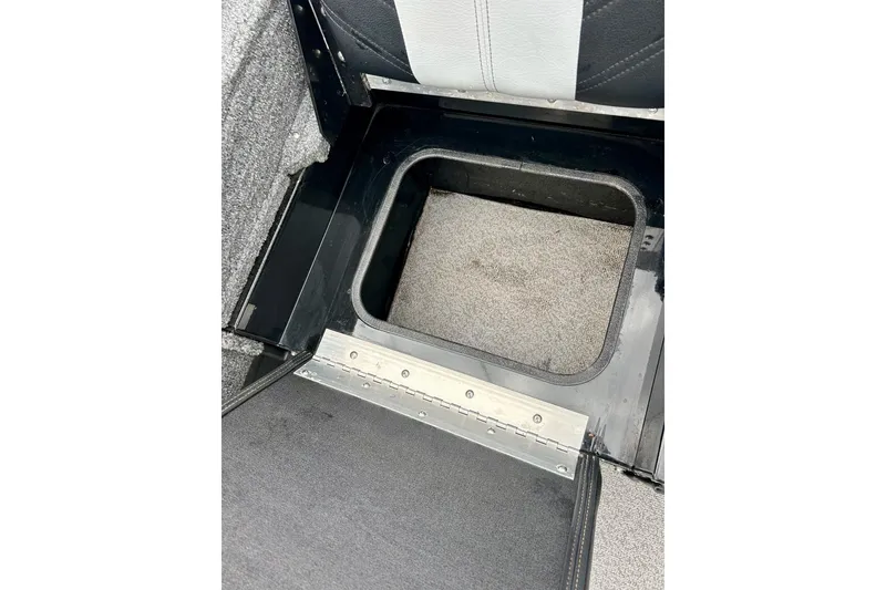 Slide: The Image of 2018 Crestliner CVN16 boat storage compartment with open hatch. - 33