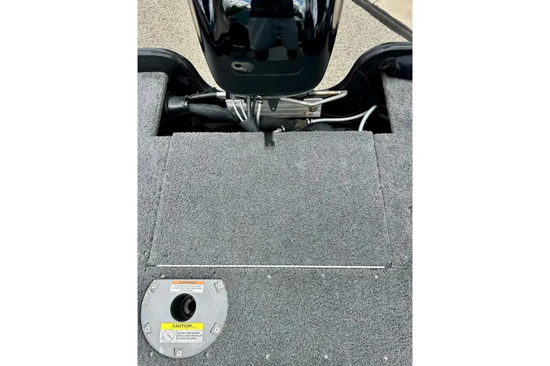 Slide: The Image of 2018 Crestliner CVN16 boat interior with motor and carpeted deck. - 34