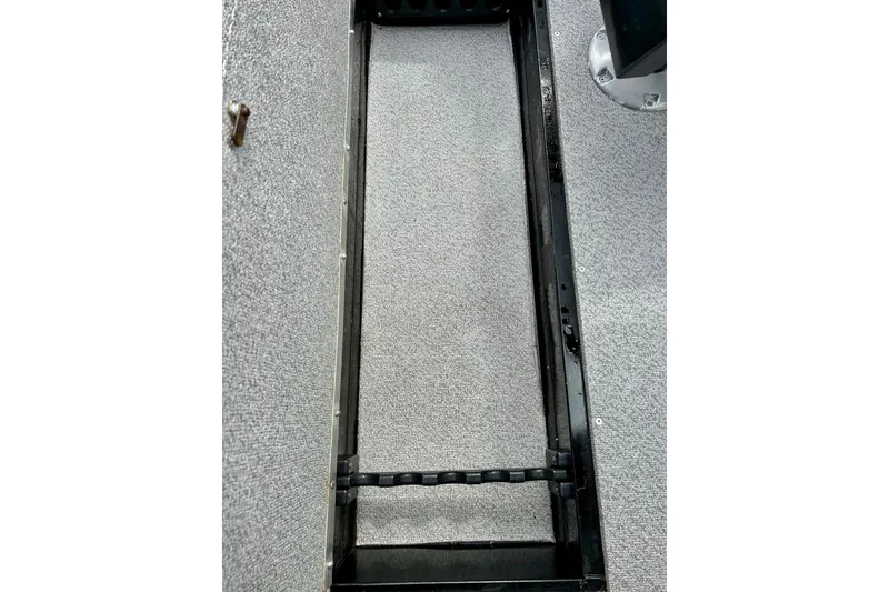 Slide: The Image of Interior view of a 2018 Crestliner CVN16 boat, showcasing a storage compartment. - 42