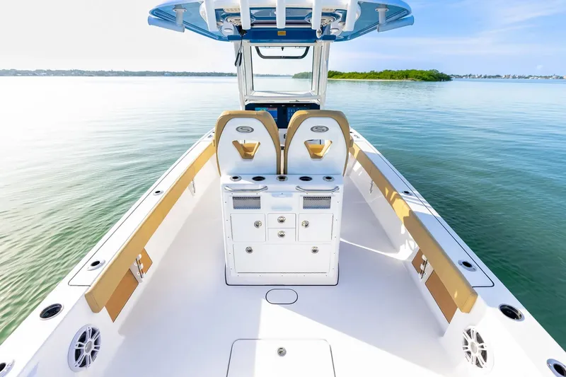 Slide: The Image of 2026 Sportsman Masters 267OE Bay Boat interior, featuring sleek design and spacious seating on calm waters. - 12