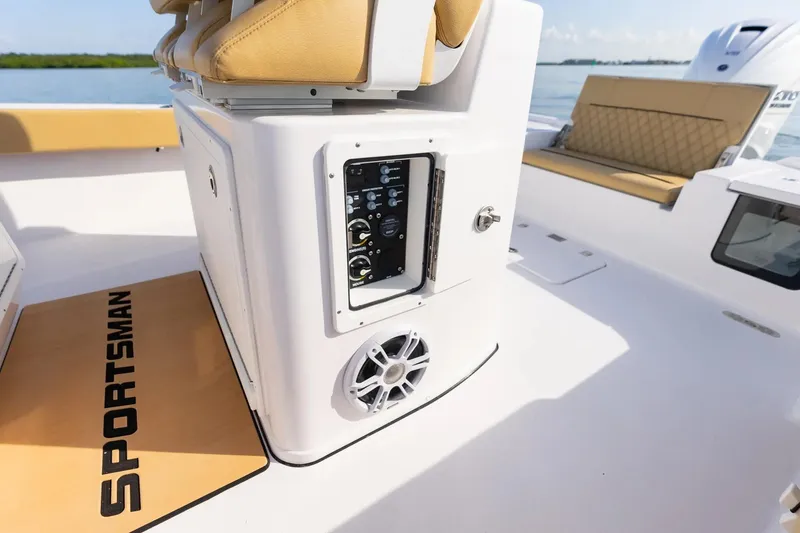 Slide: The Image of 2026 Sportsman Masters 267OE Bay Boat interior with control panel and seating. - 13