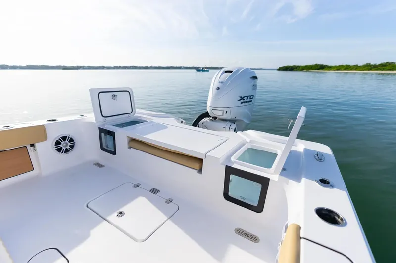 Slide: The Image of 2026 Sportsman Masters 267OE Bay Boat with open storage, Yamaha XTO engine, on calm water. - 15